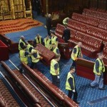 Workmen move the seats in the House of Lords before the State Opening of Parliament, at the Palace of Westminster, in London