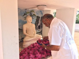 C. V. Wigneswaran Worships at Naga Vihara, the Buddhist Shrine | File photo